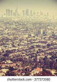 Retro stylized aerial view of Los Angeles seen through smog, USA.