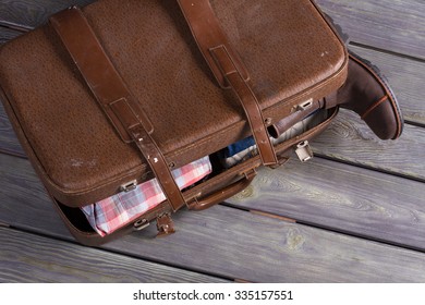 Retro Suitcase Of Inveterate Traveler. Suitcase Full Of Men's Clothing. Men Clothes Store.