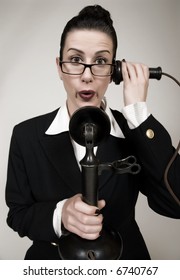 Retro Switchboard Operator With Vintage Candlestick Phone Answering A Call