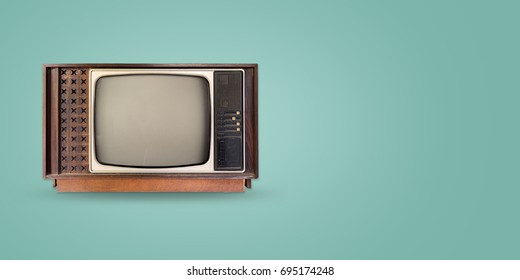 Retro television - old vintage tv on color background. retro technology. flat lay, top view hero header. vintage color styles. 