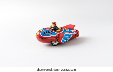 Retro Tin Rocket Spaceship Toy On A White Seamless Background