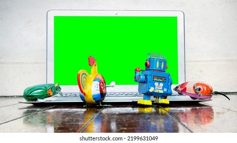 Retro Tin Toys Watching A  Laptop Green Screen 