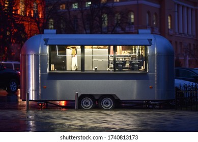 retro trailer of street food in night city