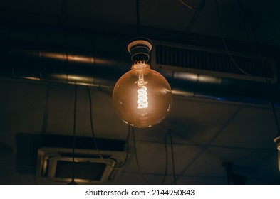 Retro Tungsten Lightbulb In A Coffee Shop