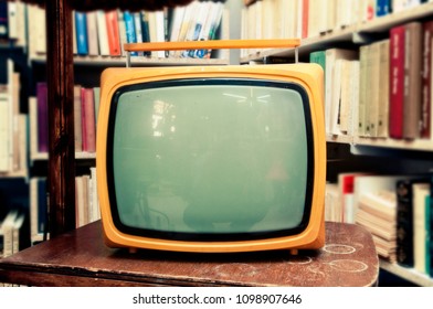 Retro TV Set In Vintage Setting - Old Living Room, With Lots Of Books In The Background