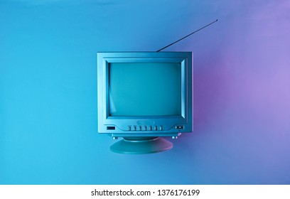 Retro Wave, 80s. Old Tv With Antenna In Holographic Light. Top View, Minimalism