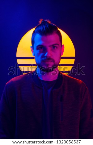 Retro wave synth wave portrait of a young man. 80s sci-fi futuristic fashion poster style violet neon.
