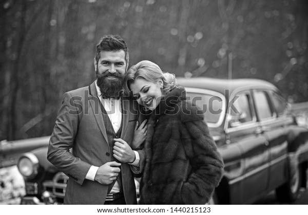 A
retro wedding car with just married couple in
love