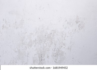 Retro whitewash wall background. Aged whitewashed wall texture with scuffs and cracks