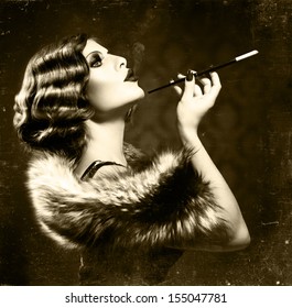 Retro Woman Portrait. Beautiful Woman with Mouthpiece. Cigarette. Smoking Lady. Vintage Styled Black and White Photo. Old Fashioned Makeup and Finger Wave Hairstyle. 20's or 30's style. Sepia toned 