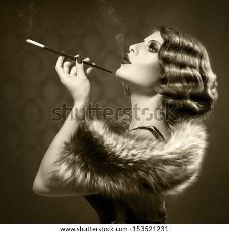 Retro Woman Portrait. Beautiful Woman with Mouthpiece. Cigarette. Smoking Lady. Vintage Styled Black and White Photo. Old Fashioned Makeup and Finger Wave Hairstyle. 20's or 30's style. Sepia toned