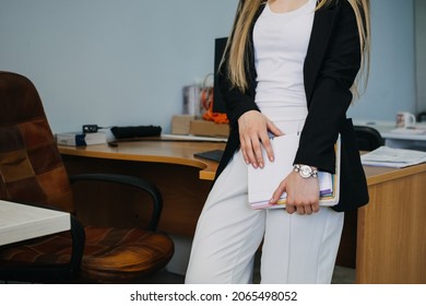 Return Office Workers, Employees Return To Offices. End Of Work From Home. Young Business Woman With Documents Walks Into The Office