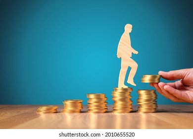 Return on investment, growing savings or wage income concept. Coins and wooden person going on increasing columns of coins. Helping hand adds more money. Successful investment concept. - Shutterstock ID 2010655520