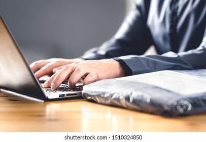 Return package after free shipping for online order. Wrong product from internet. Man writing complaint, claim or reclamation with laptop. Bad customer feedback. Shopping for clothes, jeans or shirt. - Shutterstock ID 1510324850