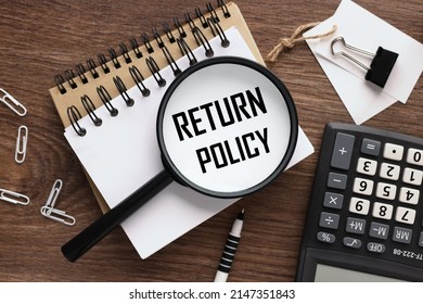 RETURN POLICY magnifying glass on a beautiful notepad. text on magnifying glass - Shutterstock ID 2147351843