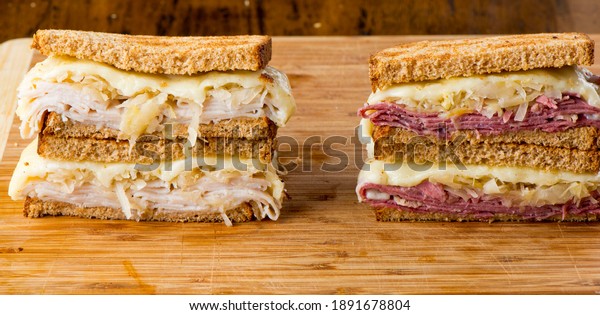 Reuben Sandwich. Classic traditional American\
sandwich. Pastrami and corned beef on grilled rye bread, melted\
Swiss cheese, sauerkraut, topped with thousand island dressing\
served french fries.