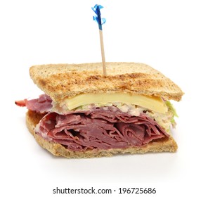 Reuben Sandwich With Pastrami And Swiss Cheese Isolated On White Background