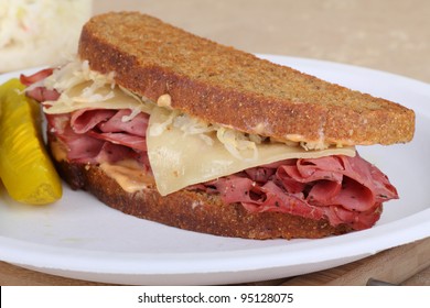 Reuben Sandwich With Pastrami And Swiss Cheese On A Plate