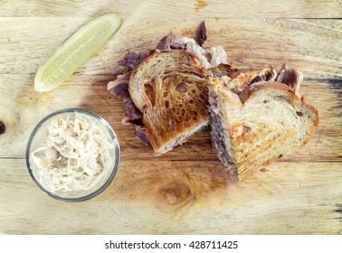 Reuben Sandwich Top View On Wooden Table