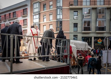 Reus, Spain. March 2022: Catholic Priest Blessing Domestic And Farm Animals During The Catalan Parade Called Tres Tombs