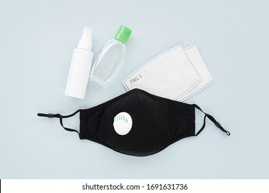 Reusable antiviral masks with breather filter valve and hand sanitizer. Cotton  masks with activated carbon filter.  Protection against flu and coronavirus, pollution, virus. Personal hygiene  