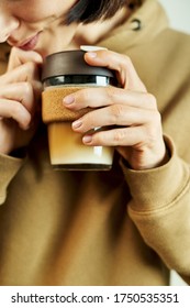 Reusable Glass Takeaway Coffe Cup With A Plastic Lid In Hand's Female.