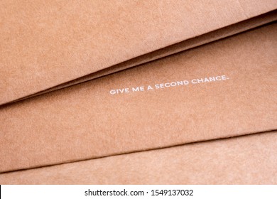 Reuse background. Words on craft paper. Give me a second chance. World resources concept. Reusing paper-based products. Ecological problems. Reusing concept. Reuse background. Words on craft paper. 
