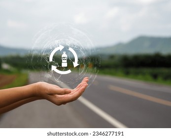 reusing bottles Young woman's hand showing recycling of plastic bottles recycling Reducing plastic waste that is toxic to the world - Shutterstock ID 2346277191