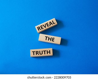 Reveal the truth symbol. Concept word Reveal the truth on wooden blocks. Beautiful blue background. Business and Reveal the truth concept. Copy space - Shutterstock ID 2228009703