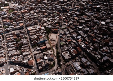 A revealing aerial view of Medellín's ghetto, highlighting the densely packed buildings and vibrant street life of this Colombian neighborhood.