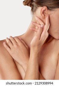 Reveling in her softness. Closeup studio shot of a beautiful young woman caressing her skin. - Shutterstock ID 2129308994