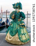 Reveller In Traditional Elaborate Mask And Costume At Venice Carnival (Carnevale di Venezia). Venice, Veneto, Italy, Europe