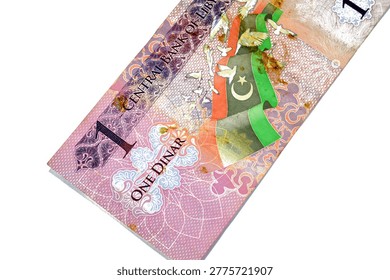 The reverse of a 1 Libyan Dinar banknote issued by the Central Bank of Libya, Depicts the national flag of Libya alongside white doves, representing peace and a new beginning