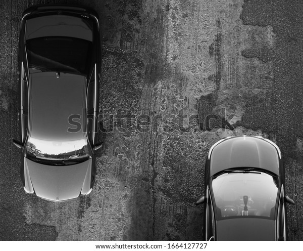 Reverse movement of two black\
cars