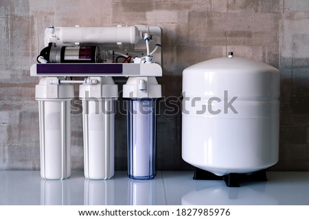 Reverse osmosis water purification system at home. Installed water purification filters. Clear water concept