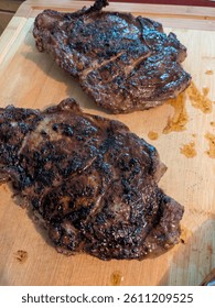 Reverse seared ribeye steak on a bamboo board