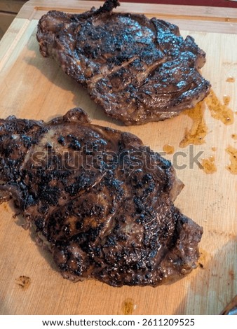 Reverse seared ribeye steak on a bamboo board