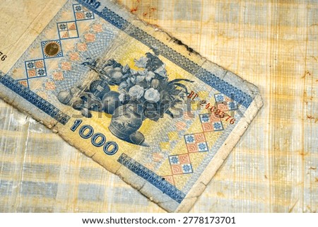 Reverse side of a 1000 Rubles banknote from Belarus, The note features an image of the National Museum of Art of Belarus on obverse and a still life painting of flowers in a vase and fruits reverse