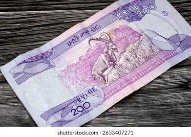 the reverse side of 200 ETB two hundred Ethiopian Birr cash money bill issued by the national Bank of Ethiopia, features Nubian ibex (Capra Nubiana) in mountainous landscape