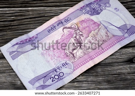 the reverse side of 200 ETB two hundred Ethiopian Birr cash money bill issued by the national Bank of Ethiopia, features Nubian ibex (Capra Nubiana) in mountainous landscape