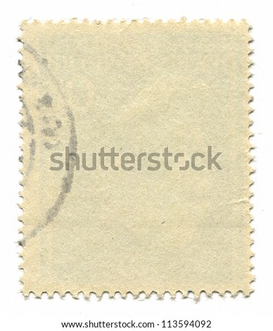 The reverse side of a postage stamp.