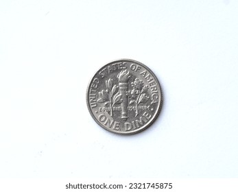 the reverse of an uncirculated 2005 US one dime coin with minor scuffs and scratches, close-up on a white background