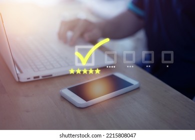 Review Check Box In Good Quality Or Five Stars Rating For Show Satisfication Pop Up From Mobile Phone On Blur Man Use Laptop Computer Background