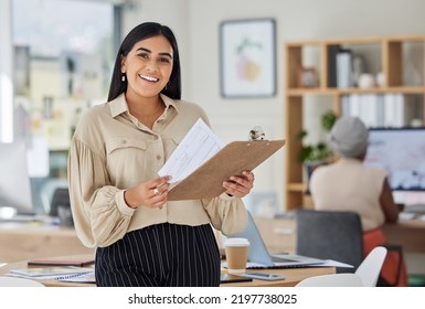 Review, contract and report with a business woman holding a clipboard with paperwork in her office at work. Application, document and proposal with a young female employee reading notes and working - Shutterstock ID 2197738025