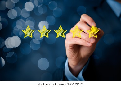 Review, increase rating or ranking, evaluation and classification concept. Businessman draw five yellow star to increase rating of his company. Bokeh in background.