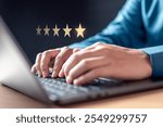 review, satisfaction, survey, star, excellent, ranking, quality, assessment, evaluation, feedback. A person is typing on a laptop with a star rating system above them, likely giving a rating or review