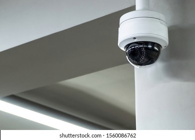 A review of surveillance cameras on white background. Security concept. Facial recognition. Program search for criminals.