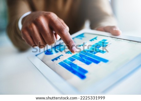 Reviewing the quantitative business data. Closeup shot of an unidentifiable businessman using a digital tablet in an office.