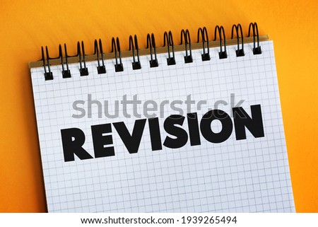 Revision - process of reviewing or making changes to something that has been previously created or written, text concept on notepad
