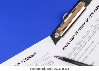 Revocation of power of attorney form. Office desk and clipboard with agreement. Top view 